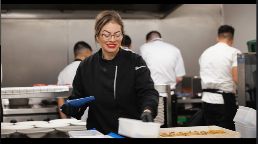 Camila working in a professional kitchen
